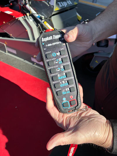 Handheld remote control for operating Asphalt Zipper's CTL reclaimer attachments.