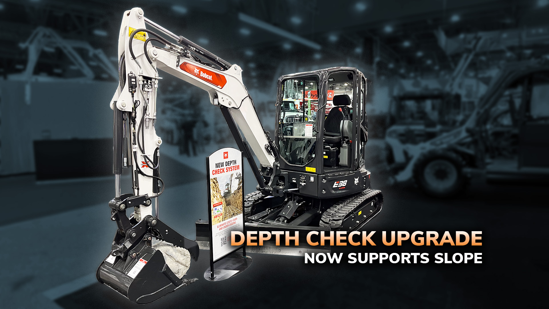 Takeuchi mini excavator with depth check upgrade feature supporting slope capability in industrial setting