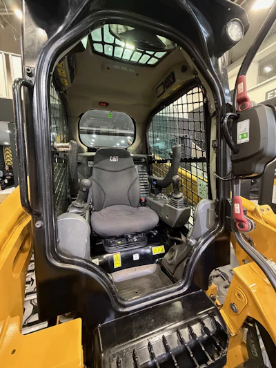 An open canopy or enclosed cab configuration is available.