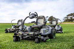 Collection of EGO zero-turn radius lawn mowers displayed on green grass field
