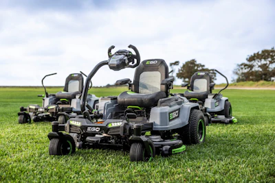 Collection of EGO zero-turn radius lawn mowers displayed on green grass field