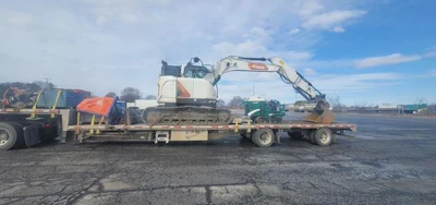 This 2019 Freightliner toting a Bobcat excavator was stopped in Salina after allegedly striking more than a dozen bridges on the New York Thruway.