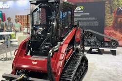 Red and black SV tracked skid steer loader with tinted undercarriage technology displayed at trade show
