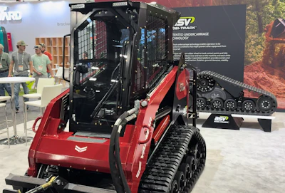 Red and black SV tracked skid steer loader with tinted undercarriage technology displayed at trade show