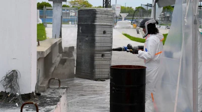 FIU Professor Atorod Azizinamini demonstrates application of Sprayable Ultra-High Performance Concrete.