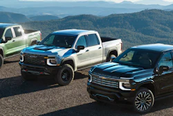 From left, 2027 Chevrolet Silverado 1500 Trail Boss in Trillium Metallic, ZR2 in White Sands and High Country in Black.