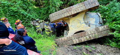 This excavator overturned July 1 in Millbrook, New York, slid down an embankment and trapped the operator inside.