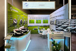 ORBBEC exhibition booth showcasing 3D vision technology for robotic mowers with product displays and interactive demo area