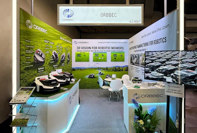 ORBBEC exhibition booth showcasing 3D vision technology for robotic mowers with product displays and interactive demo area