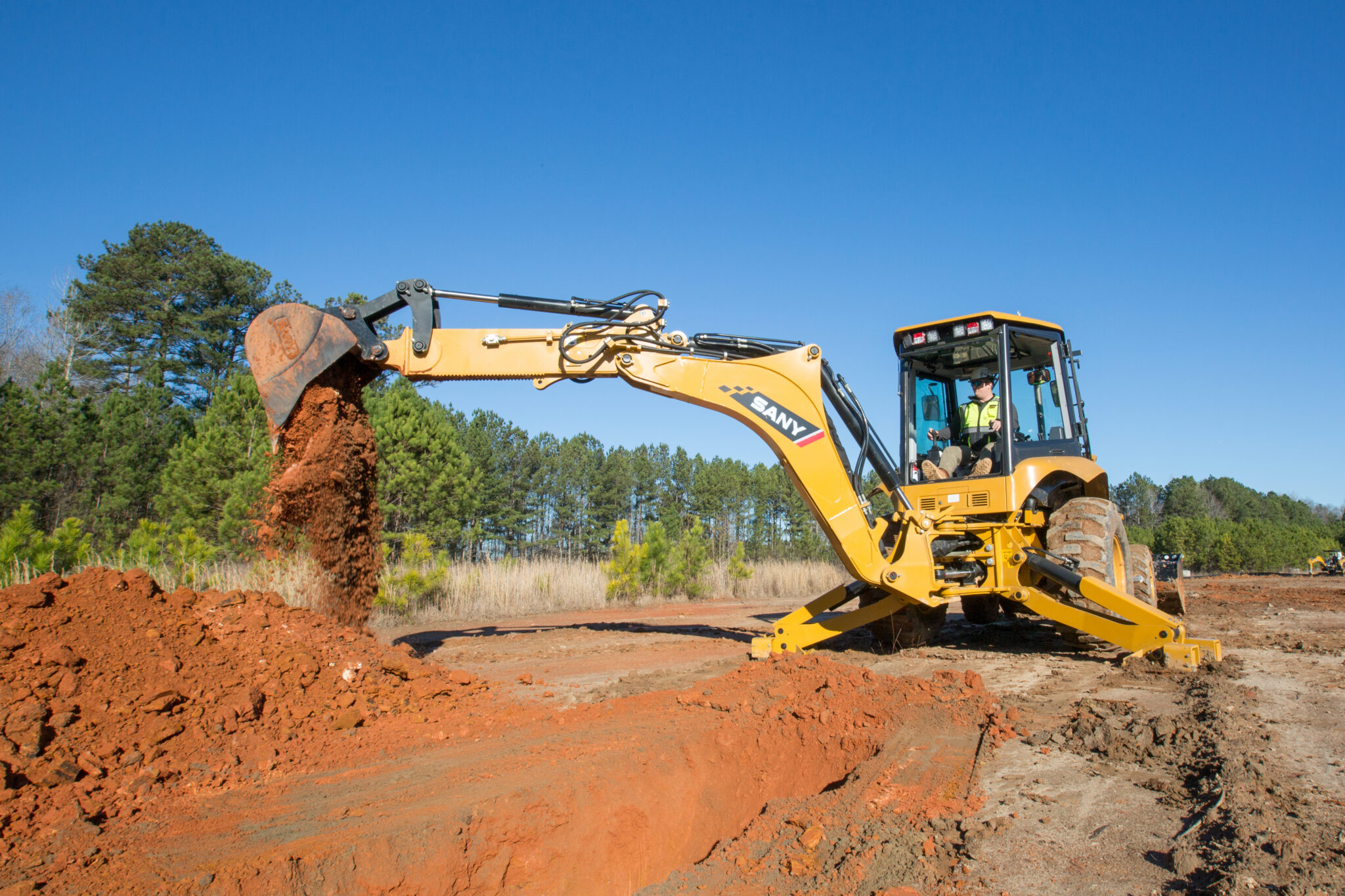 Sany's new BHL95 backhoe gets a telescopic arm for 3 more feet of dig depth and reach.