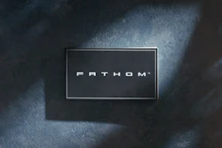 FATHOM logo displayed on dark textured surface with dramatic lighting