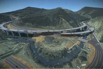 A rendering of the future I-70 Floyd Hill Project I-70 alignment looking south, with westbound I-70 braiding over eastbound I-70 at the bottom of Floyd Hill.