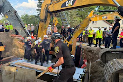 A 50-year-old worker is rescued September 2, the fourth trench-collapse emergency operation in southeast Michigan since June 30.