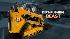 Yellow Caterpillar 289D compact track loader with marketing text 'Dirt-Pushing Beast' in industrial warehouse setting