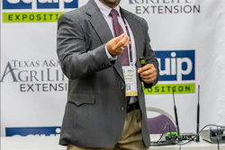 Professional man speaking at Texas A&M AgriLife Extension EQUIP Exposition conference with branded backdrop