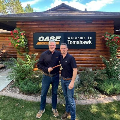 Terry Dolan (left) passes the tomahawk to Kris Dahl (right), as the next leader of CNH's construction brands.