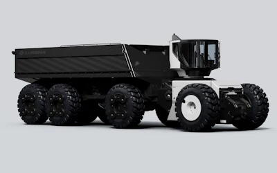 Black and white :umina Roadrunner articulated dump truck with large tires shown in side profile against gray background