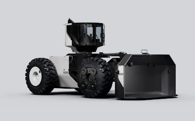 Black and white Lumina Roadrunner articulated wheel loader with large tires and enclosed cabin on neutral background