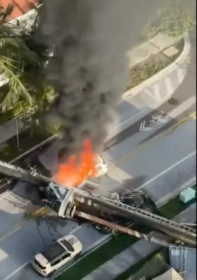 When this piling rig tipped over September 14 in Miami, it landed on the front of a white BMW causing the SUV to burst into flames. The quick-thinking driver was able to scramble out the back. Two parked vehicles were crushed. The rig operator, two construction workers and the SUV driver were treated for minor injuries.