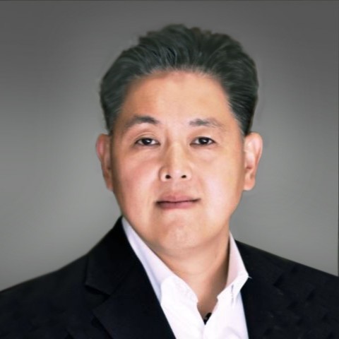 Edward Song new president Doosan Bobcat North America in business attire with dark blazer and white shirt