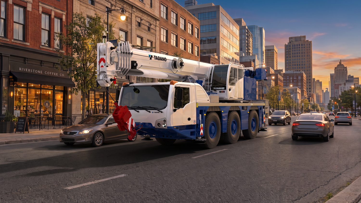White and blue Tadano mobile crane truck on urban city street at sunset with buildings and traffic