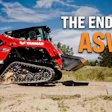 Red Yanmar compact track loader with rubber tracks on sandy terrain under blue sky
