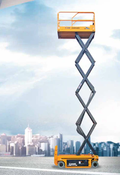Yellow XCMG XG2632AC scissor lift platform fully extended against city skyline backdrop